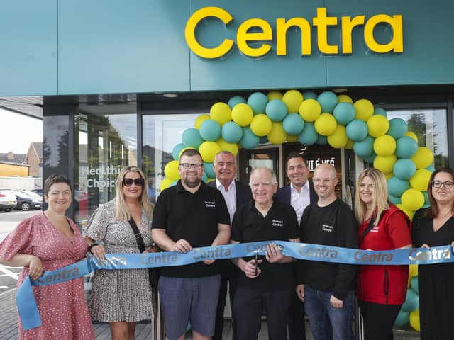 The Woolsey family at their official store launch in 2025: (l-r) siblings Christine McNally, Amanda Woolsey, Gordon Woolsey, father Don Woolsey, James Woolsey, Pauline Woolsey and Julie-Ann Liggett. They are joined by Musgrave NI Managing Director Trevor Magill (back, centre left) and Retail Sales Director David Higgins (back, centre right).