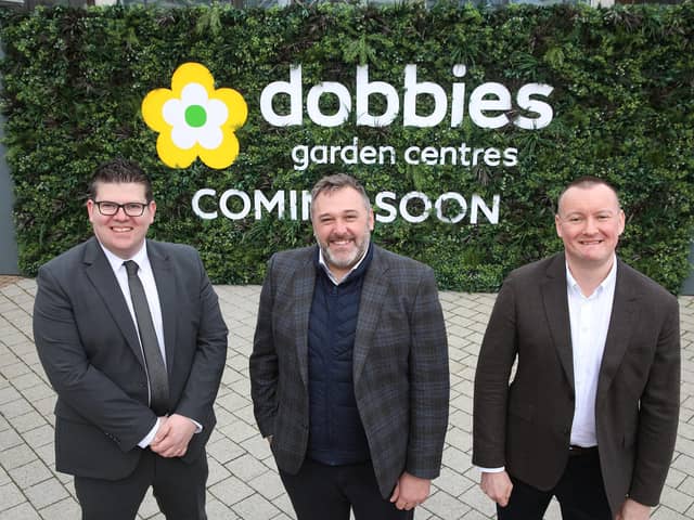Landlord Lotus Property officially hands redeveloped site over to garden retailer. Pictured are Junction Centre director Chris Flynn, Lotus Property managing director Alastair Coulson and Dobbies CEO Graeme Jenkins