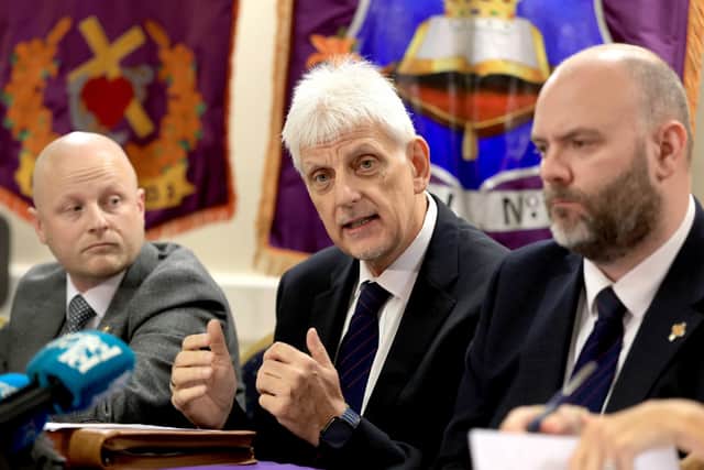 Loyalist activist Jamie Bryson, Portadown District Master Nigel Dawson and Portadown deputy District Master Alastair Power, during a press conference at Carleton Street Orange Hall in Portadown, Co Armagh, announcing their next steps in relation to the Drumcree parade. Pic: Liam McBurney/PA Wire