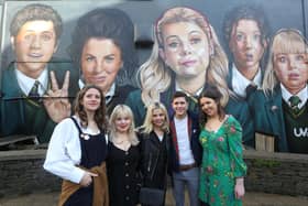 Derry Girls cast members Louisa Harland, Nicola Coughlan, Saoirse-Monica Jackson, Dylan Llewellyn, and creator Lisa McGee when they visited the 'Derry Girls' mural painted by UV Artists on the gable wall of Badger's Bar, Derry. (Photo Lorcan Doherty)