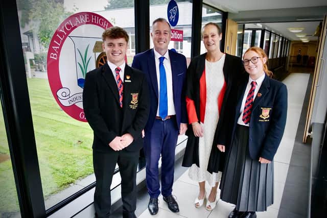 Education Minister Paul Givan joins Principal Dr Michelle Rainey, Head Girl Maisie and Head Boy Adam at Ballyclare High School to announce that three post-primary school projects are moving forward to the design and planning stage