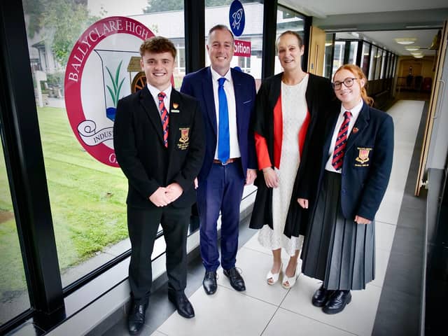 Education Minister Paul Givan joins Principal Dr Michelle Rainey, Head Girl Maisie and Head Boy Adam at Ballyclare High School to announce that three post-primary school projects are moving forward to the design and planning stage