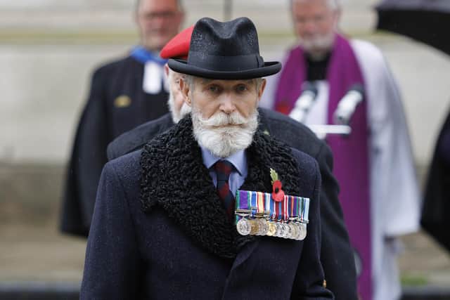 Paddy Shields, wearing military service medals and a remembrance poppy, attends the opening of a Field of Remembrance at Belfast City Hall. Photo: Liam McBurney/Press Association