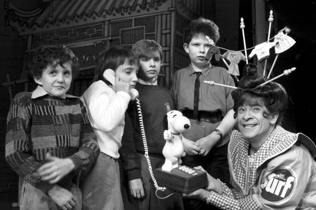 1985 - Scottish entertainer Stanley Baxter was playing Widow Twankey in Aladdin, and he took time out to present a Snoopy telephone to four children from Graysmill School in Edinburgh.