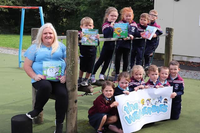Yvonne Fleming (The Weatherbies Author) with pupils from St Brigid's Primary School, Maghera