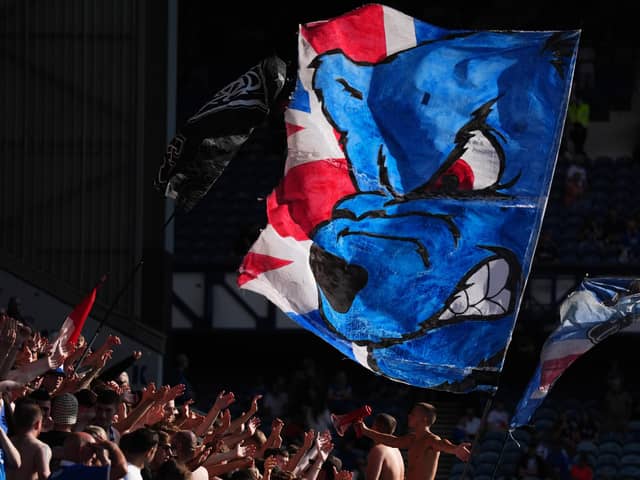 Members of the Rangers fan group the Union Bears display a flag. (Photo by Andrew Milligan/PA Wire)