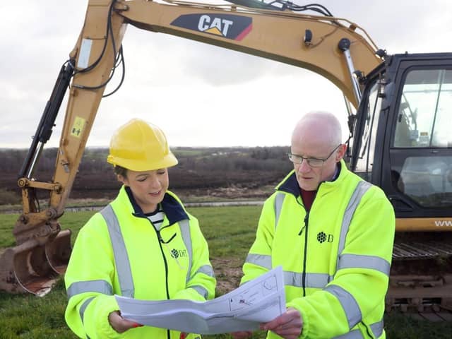 Sinn Fein Infrastructure Minister Kimmins pictured at the A5 with Seamus Keenan, DfI Roads, in March 2025 - before work was halted.