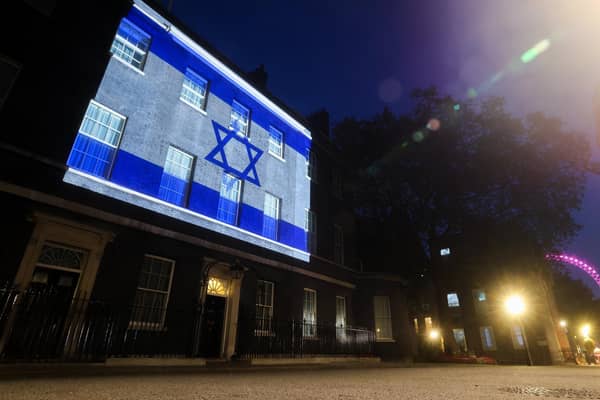 The Israeli flag shines on Ten Downing Street in solidarity with the people of Israel. The Government has asked all UK government buildings to do likewise.