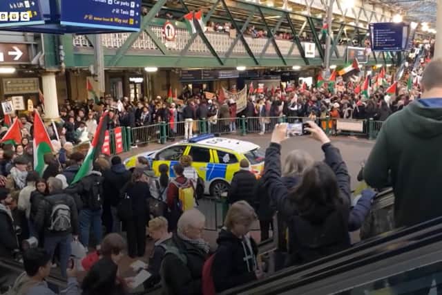 Protestors against the Israeli siege of Gaza at Waverley Station in Edinburgh on Saturday (footage from BBC)