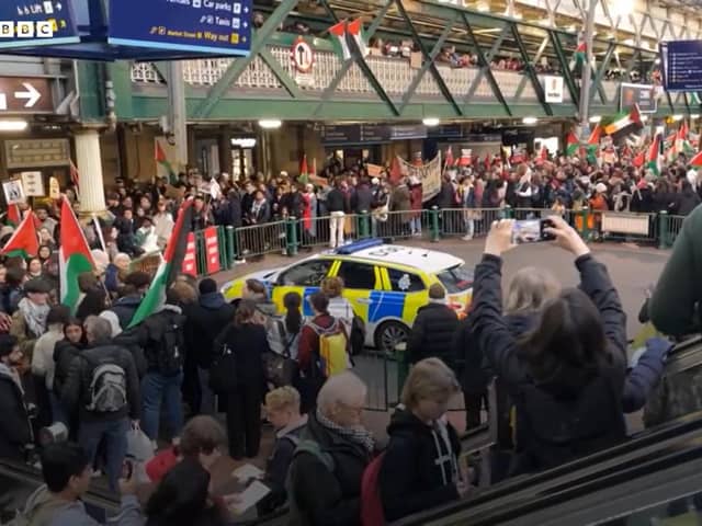 Protestors against the Israeli siege of Gaza at Waverley Station in Edinburgh on Saturday (footage from BBC)
