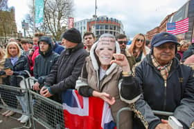A demonstrator wearing a mask depicting US President Joe Biden stands outside Ulster University, as the US President makes a speech inside, in Belfast on April 12, 2023, as part of his four day trip to Northern Ireland and Ireland for the 25th anniversary commemorations of the "Good Friday Agreement"