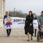 Six-year-old Daithi Mac Gabhann and his parents Mairtin Mac Gabhann (right) and mother Seph Ni Mheallain (left) arrive at Parliament Buildings at Stormont, ahead of a recalled sitting of the Assembly focused on a stalled organ donation law. The law introducing an opt-out donation system in Northern Ireland has been named after Daithi, who is awaiting a heart transplant.