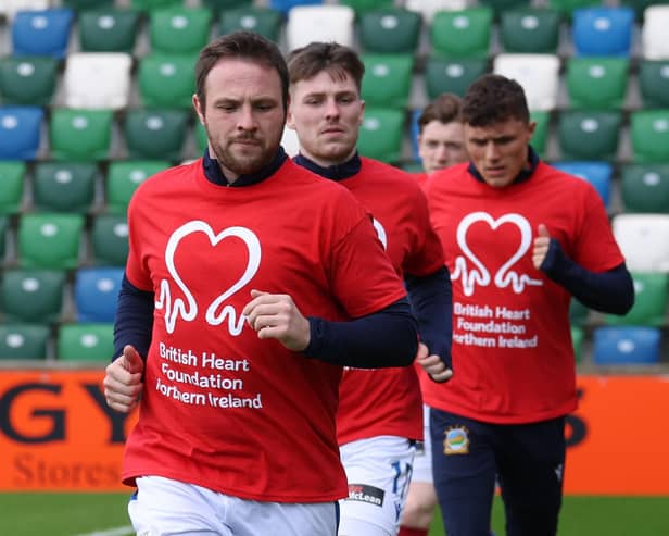 Linfield's Jamie Mulgrew donned a specially designed t-shirt to raise awareness in conjunction with a partnership between the Northern Ireland Football League and the British Heart Foundation