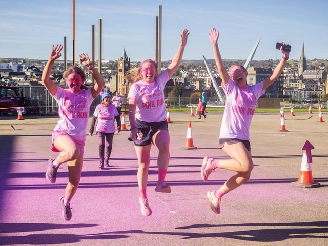 Runners, walkers, and pooches were splashed in pink powder from head to toe for a great cause as Cancer Focus NI’s first Pink Run took place in Londonderry. Picture Steven McAuley/McAuley Multimedia