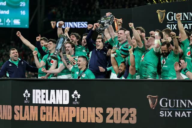 Johnny Sexton, the Ireland captain, holds the Six Nations trophy as Ireland celebrate their Grand Slam victory at the Aviva Stadium in Dublin on Saturday.
