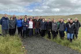 DAERA Minister Andrew Muir at the launch of the Northern Ireland Peatland Strategy 2040 on Divis Mountain on the outskirts of Belfast with members of the Peatland Collaborative Network. Pic: DAERA/PA Wire