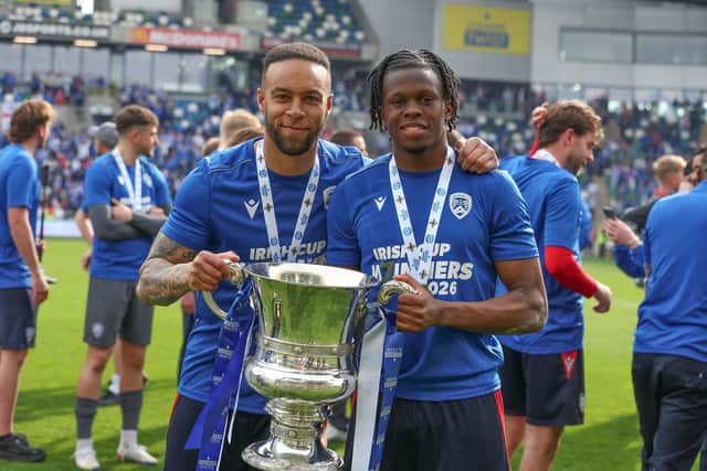 Charles Dunne (left) with the Irish Cup after Coleraine's final win over Dungannon Swifts. (Photo by Desmond Loughery/Pacemaker Press)
