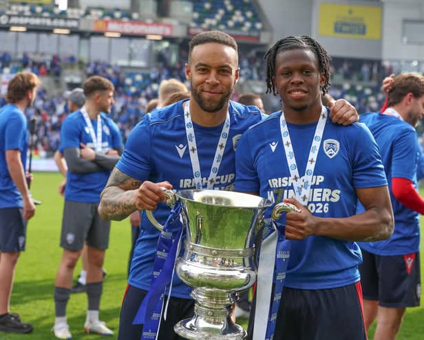 Charles Dunne (left) with the Irish Cup after Coleraine's final win over Dungannon Swifts. (Photo by Desmond Loughery/Pacemaker Press)