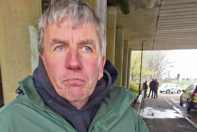 Businessman James Sheridan at Sandyknowes Roundabout, with the other protestors in the background