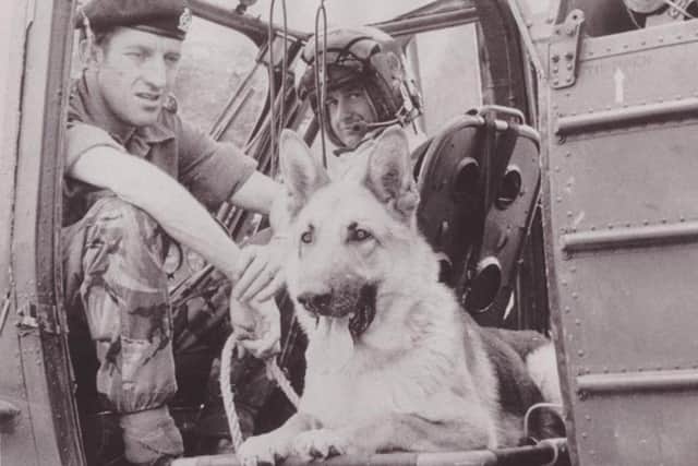 Undated handout photo issued by the South East Fermanagh Foundation (SEFF) victims and survivors group of Corporal Bryan Criddle and helicopter pilot Sergeant Stan Richie with army dog Jason in Northern Ireland. Photo: SEFF/PA Wire