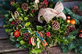 Create your own Christmas wreath from garden sprigs, twigs and cuttings, bright berries and evergreen foliage.