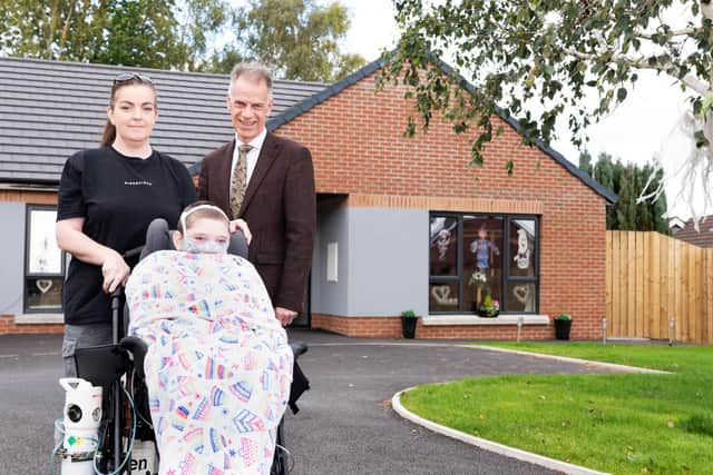 Catriona Adams and her son Caoimhin pictured with Michael McDonnell, Choice Group Chief Executive outside their new bespoke home. Catriona and her family moved into their new home in July this year, a property that will make a significant difference particularly to her youngest son Caoimhin who was diagnosed with Cerebral Palsy, chronic lung disease, severe autism  and Encephalopathy.