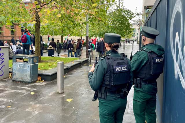 Officers from the PSNI observe a Defend Our Juries protest in support of Palestine Action on Chichester Street, Belfast on Saturday: David Young/PA Wire