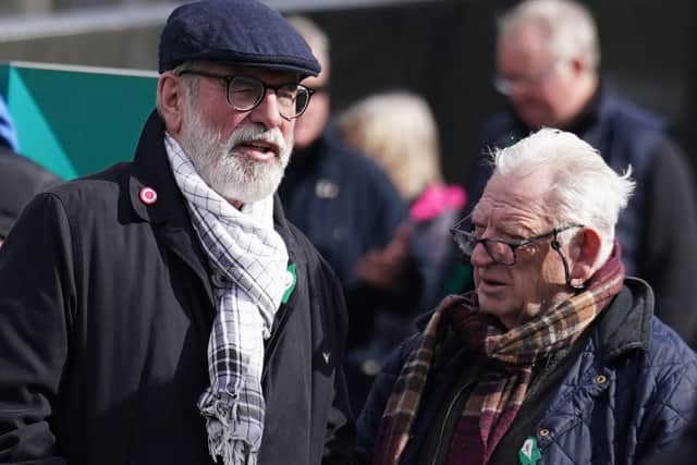 Former Sinn Fein president Gerry Adams (left) speaks to Nicky Kelly as they attend the funeral service of veteran republican Rose Dugdale