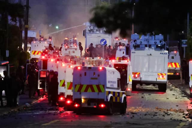PSNI officers at the Sandyknowes roundabout in north Belfast during disturbances on Wednesday evening