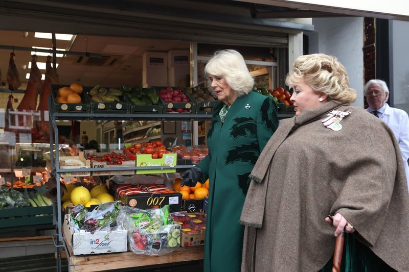 Queen Camilla (left) with Lord-Lieutenant Dame Fionnuala Jay-O'Boyle during a visit to Lisburn Road in Belfast to meet shop owners and staff, and learn about their positive contribution to the community during her two-day official visit to Northern Ireland.