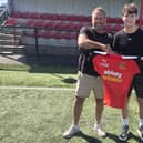 Annagh striker Henry Cromack (right) with first-team coach Paul Matchett following his close-season arrival at the Championship club. (Photo by Annagh United FC)