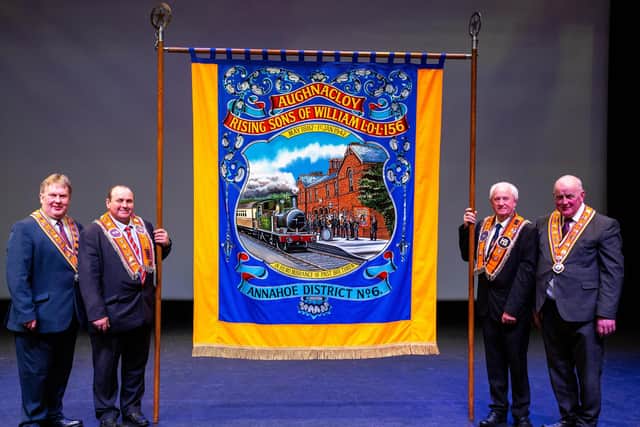The Grand Master and Deputy Grand Master pictured with the ‘Banner of the Year’ from Aughnacloy Rising Sons of William LOL 156