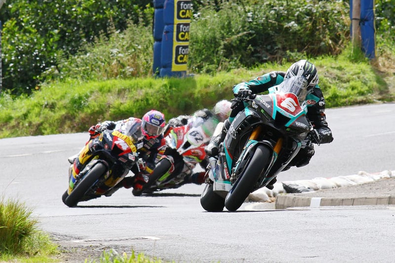 Michael Dunlop (Hawk Racing Honda) leads on the opening lap of the Open Superbike race at Armoy from Davey Todd (Milenco by Padgett's Honda) and Derek Sheils (Roadhouse Macau BMW)