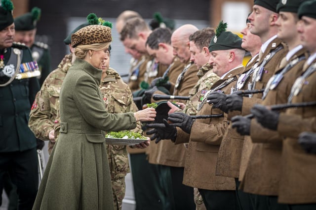Duchess of Edinburgh presents a shamrock to a member of 2 R Irish