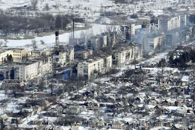 Footage of Bakhmut shot from the air with a drone for The Associated Press shows how the longest battle of the year-long Russian invasion has turned the city of salt and gypsum mines in eastern Ukraine into a ghost town. The footage was shot Feb. 13. From the air, the scale of destruction becomes plain to see. Entire rows of apartment blocks have been gutted, just the outer walls left standing and the roofs and interior floors gone, exposing the ruins' innards to the snow and winter frost.