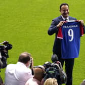 Taoiseach Leo Varadkar holds up a Linfield Football Club jersey at Windsor Park in Belfast. Pic: Dainel Fayeun/PA Wire