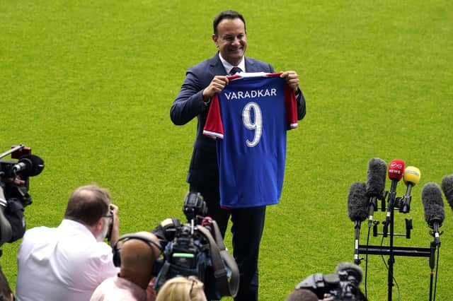 Taoiseach Leo Varadkar holds up a Linfield Football Club jersey at Windsor Park in Belfast. Pic: Dainel Fayeun/PA Wire