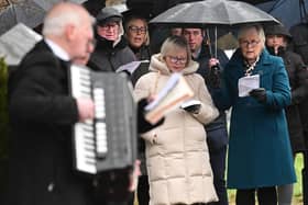 Family and friends during the anniversary service of the Teebane bombing outside Cooktown in Co Tyrone on Sunday. Photo Colm Lenaghan/Pacemaker