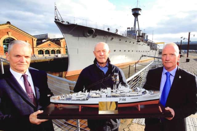 Andrew Bannister (right) and Ray McCullough (left) with Ray's model of HMS Amethyst, with Captain John Rees, Chief of Staff of the National Museum of the Royal Navy