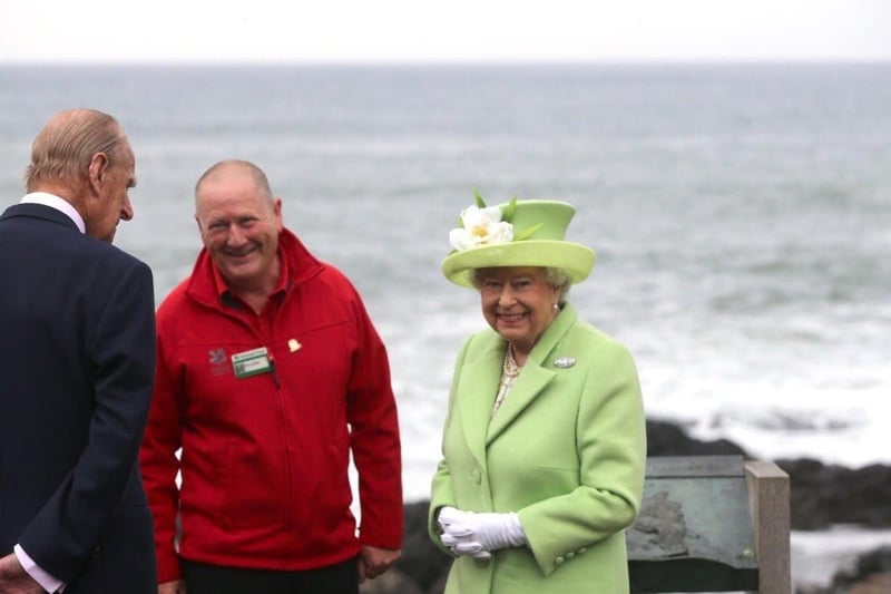 Bushmills man Neville McConachie reflects on 35 years at the Giant’s Causeway. He is pictured with the late Queen and Prince Philip