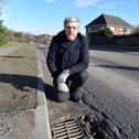 John O'Dowd, pictured while campaigning for repairs to potholes in the Lurgan area a number of years ago.