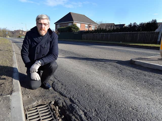 John O'Dowd, pictured while campaigning for repairs to potholes in the Lurgan area a number of years ago.