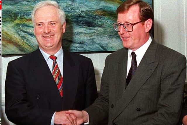 The then Ulster Unionist Party MP David Trimble, shakes hands with Taoiseach John Bruton at the government buildings in Dublin in October 1995, the month after Mr Trimble became his party leader. A devout Roman Catholic, Mr Bruton's repudiation of IRA terror was as much on moral as political grounds