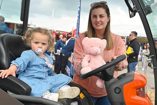 Saoirse McCourt and Emma from Omagh checking out the transport options at the Balmoral Show. Photo: Arthur Allison/Pacemaker Press