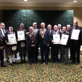At a Royal Black event in the USA last autumn Sovereign Grand Master Rev William Anderson (centre) with Grand Master of the Grand Black Chapter USA James McCullough, Red Cross certificate recipients and lecturing teams