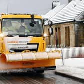 Snow plough and gritting lorry