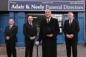 Funeral Manager Wayne Glenn (centre left) with Adair & Neely staff at their new premises