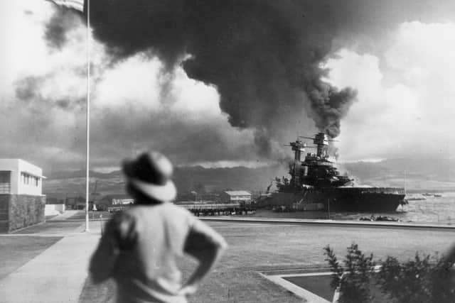 American ships burn during the Japanese attack on Pearl Harbor, Hawaii, in this Dec. 7, 1941 file photo.  (AP Photo, File)