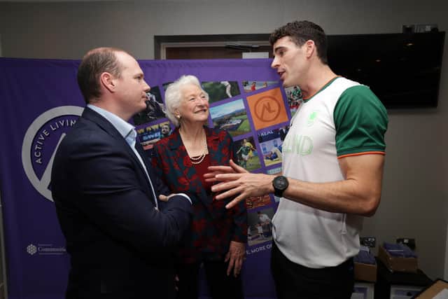 Sports Minister Gordon Lyons pictured with Lady Mary Peters and Philip Doyle at the 'Paris Celebration Event' at the SSE Arena