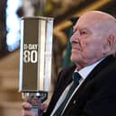 D-Day landings veteran George Horner with a beacon lit to symbolise the 'passing of the torch’ to a new generation. Photo: Michael Cooper